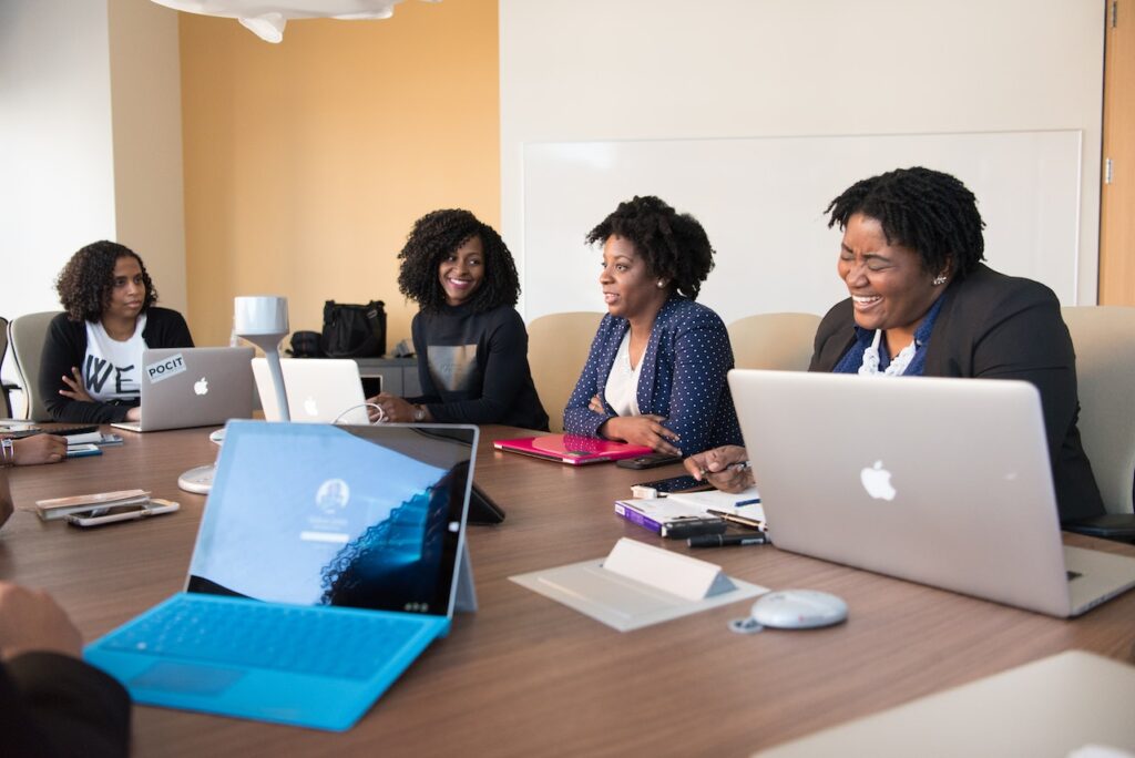 Group of black woman at a meeting desk