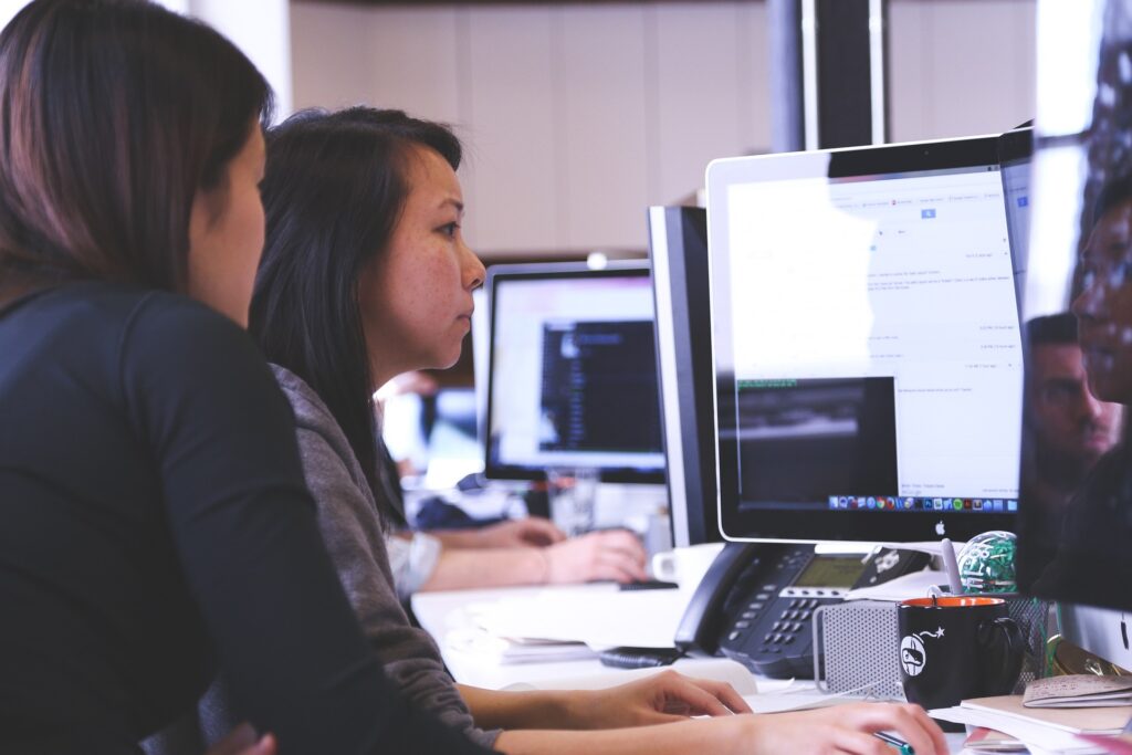 girls in front of computer business