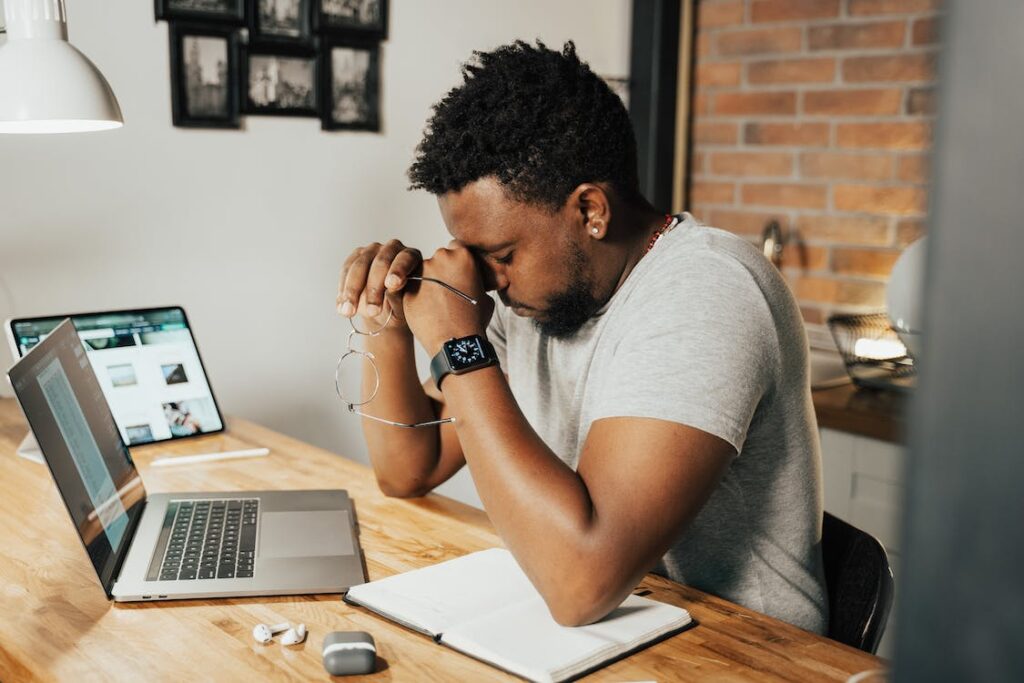 Man tired while working on his laptop.