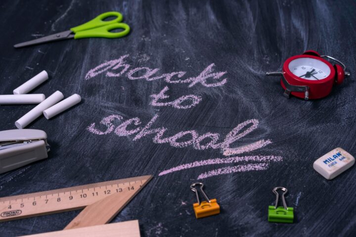 A chalk board with the words back to school on it representing back ot school marketing