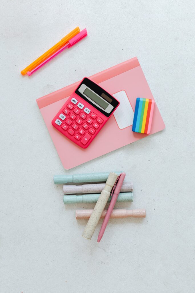 school supplies such as pens, pencils, calculator, and notebook