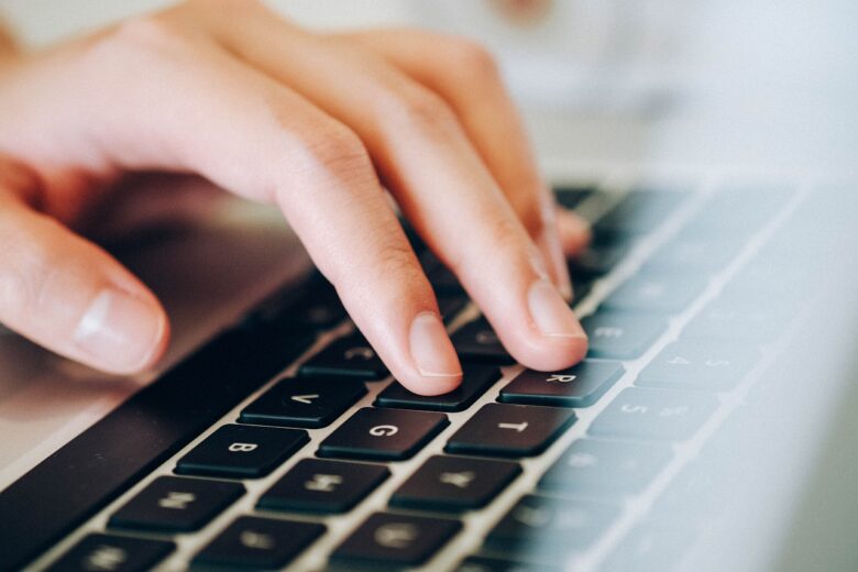 Fingers typing on a keyboard