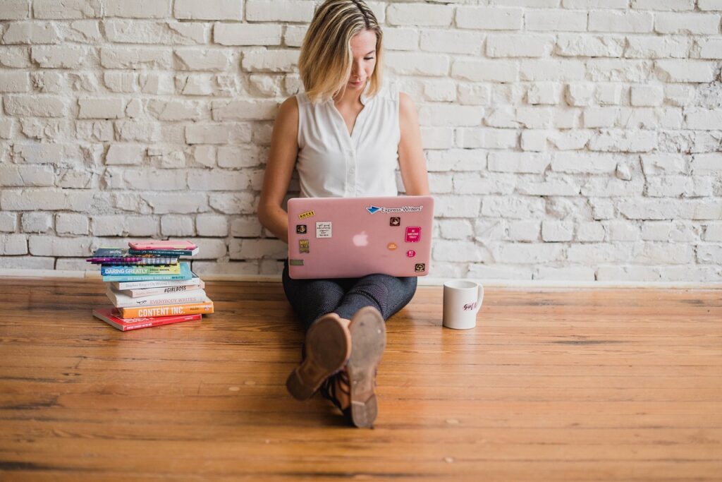 A girl typing on her laptop. 